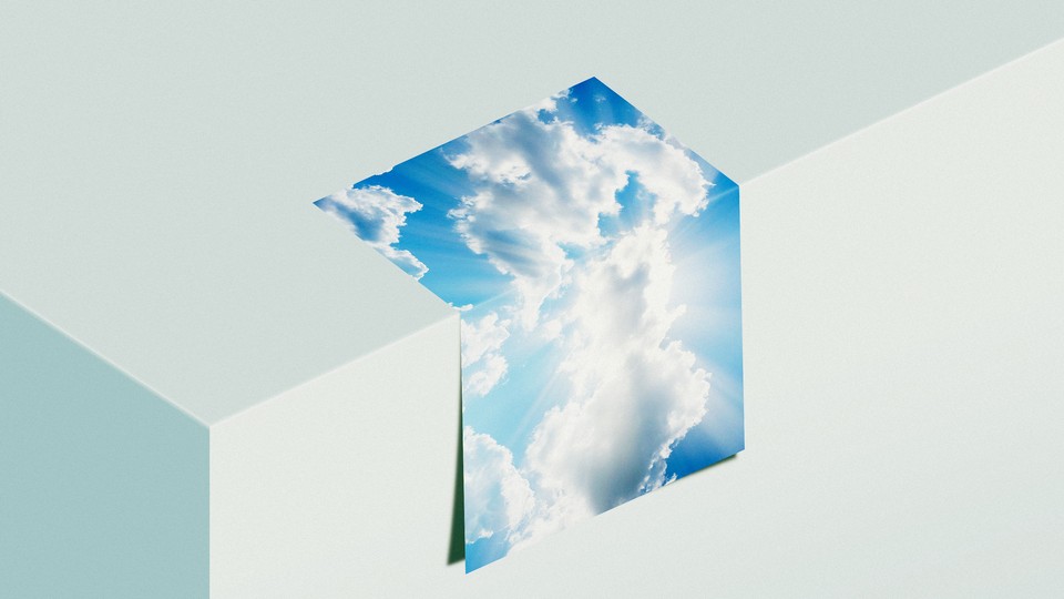 photo of a sky on a folded piece of paper on a ledge