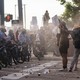 Police face off with protestors in Minneapolis during a rally for George Floyd, a black man who was killed by a white police officer