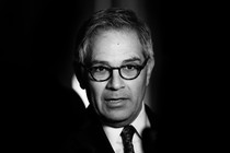 A black-and-white photo of Larry Krasner