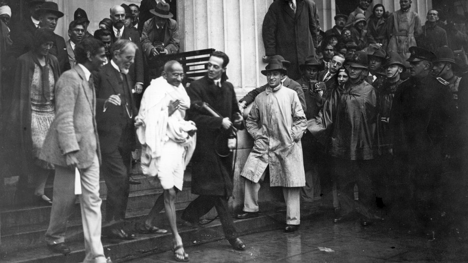 Gandhi leaves a meeting in London in 1931.