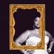 The singer Lizzo standing out of center in a picture frame