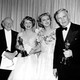 Oscar winners Clair Trevor and Walter Huston, holding their statuettes, pose with last year's winners Edmund Gwenn, far left, and Celeste Holm at the 1948 Academy Awards presentations in Hollywood, Ca., March 24, 1949.