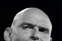 A tightly cropped photo of John Fetterman's head.