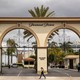 A pedestrian walks past the entrance to Paramount Pictures on Melrose Avenue in Los Angeles.