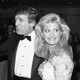 A black-and-white photograph of Donald and Ivana Trump in 1989