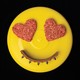photo of yellow frisbee with 2 heart-shaped ground-beef patties as eyes and arc of dog collar as smile