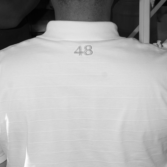 A black and white photograph of the back of Josh Shapiro's shirt with the number '48' written across it