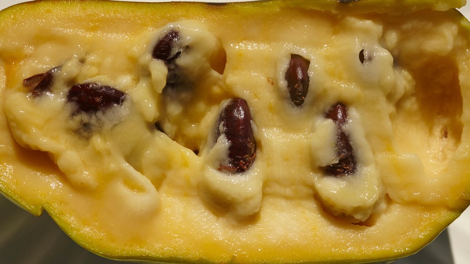 Photo of a cut-open pawpaw