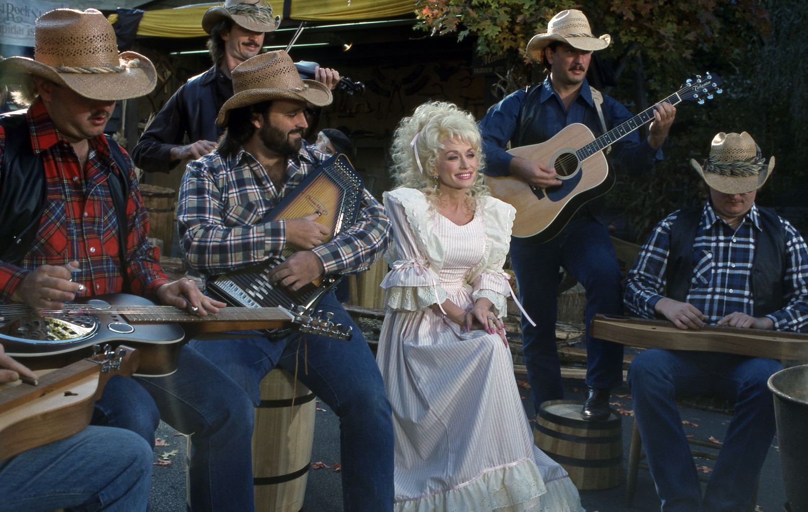 Dolly Parton sits in on a performance with a band.