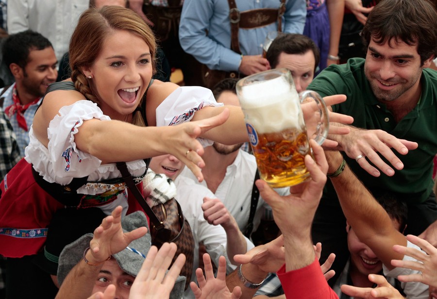 Revellers reach for the first beer mug at the Hofbräu Tent during day 1 of Oktoberfest...