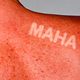 Photo-illustration of a sunburned back and shoulder, with the letters "MAHA" unburned