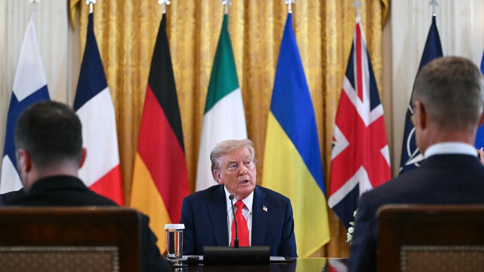trump with flags behind