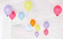 An image of balloons in an office.