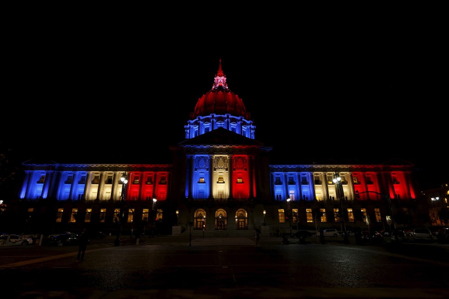 San Francisco City Hall lit up in blue, white, and red