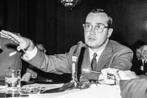 A photograph of Newton Minow at a hearing in 1961