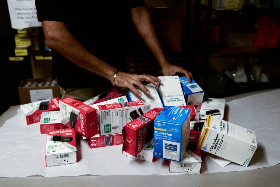 A table with many boxes of medicine piled up.