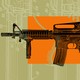 an AR-15 against a backdrop of design plans