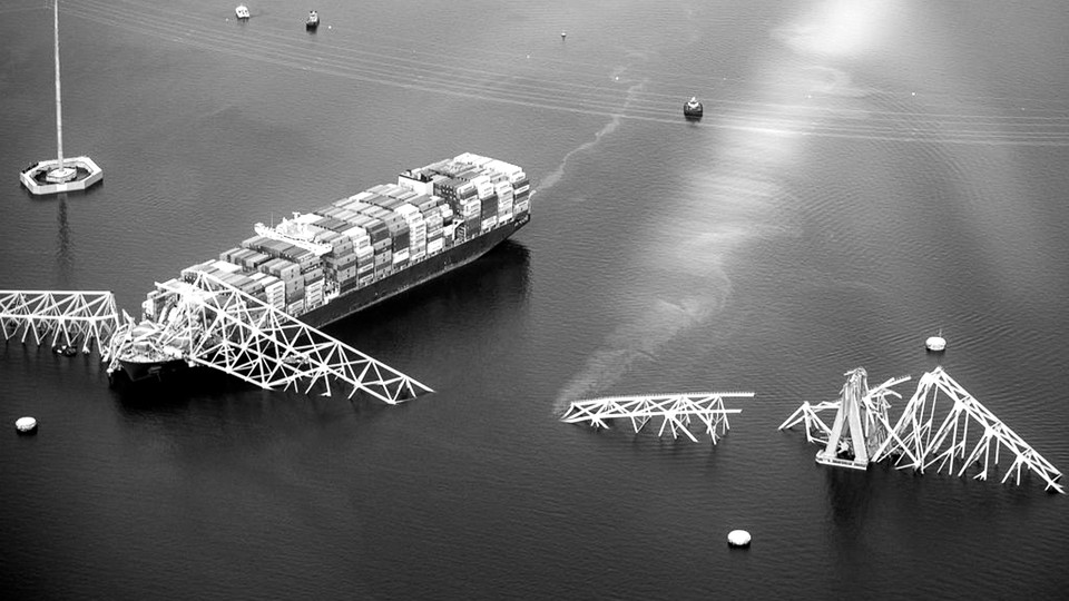 black-and-white aerial photo of the container ship Dali and the collapsed Francis Scott Key Bridge in the Patapsco River