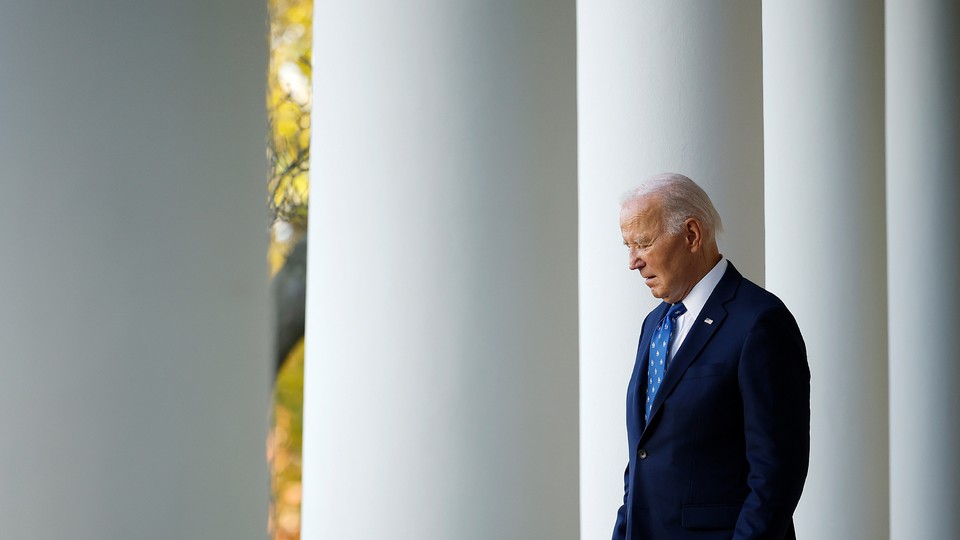 Biden walking through white columns