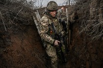 Ukrainian troops outside the town of Novoluhanske