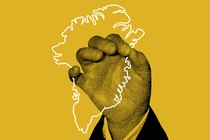 A hand holding a Greenland-shaped polygon