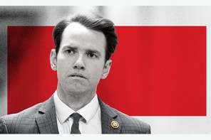 A black-and-white photograph of Kevin Kiley in front of a red square