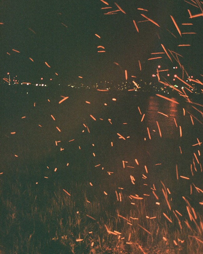 Orange sparks light up a night sky