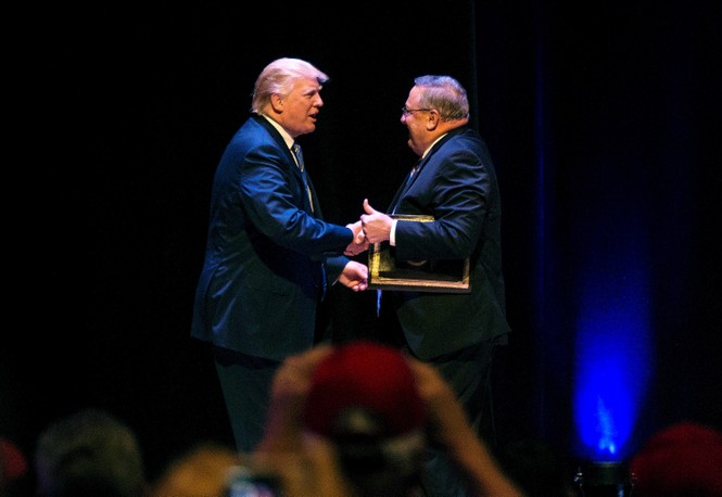 Picture of Donald Trump shaking hands with Paul LePage being introduced at a rally in Merrill Auditorium on Thursday, August 4, 2016.