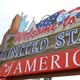 A sign stating, "Welcome to the United States of America"