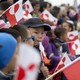 Children holding Greenland's national flag