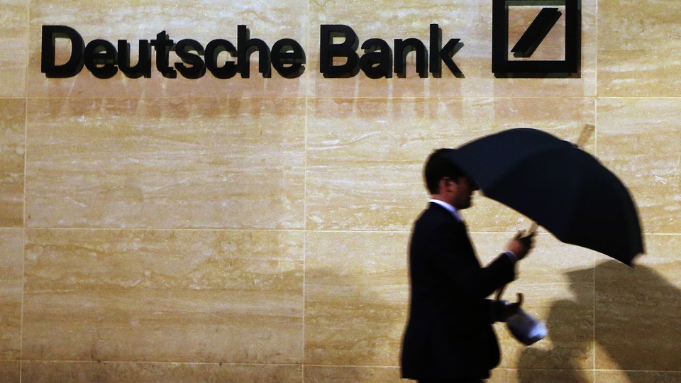 A man walks past Deutsche Bank offices in London.