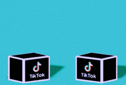 Two nurses pop out of jack-in-the-box-style cubes with the TikTok logo.