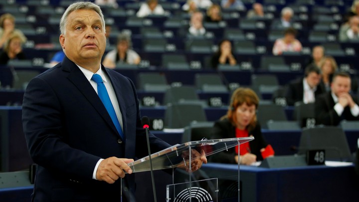 Viktor Orbán stands at a podium while addressing the European Parliament on September 11.