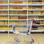 An image of a beverage aisle with a cart in front of it.