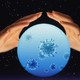 Two hands around a crystal ball with viruses inside it