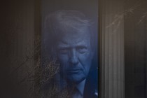 A banner with Trump's face on it blows in the wind