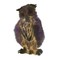 dark ink-blot-like illustration of standing horned owl on white background
