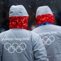 Volunteers for the upcoming 2018 Pyeongchang Winter Olympic Games walk in Pyeongchang.
