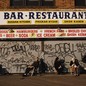 a closed restaurant with elderly patrons sitting in front of it on Brighton Beach in 1989