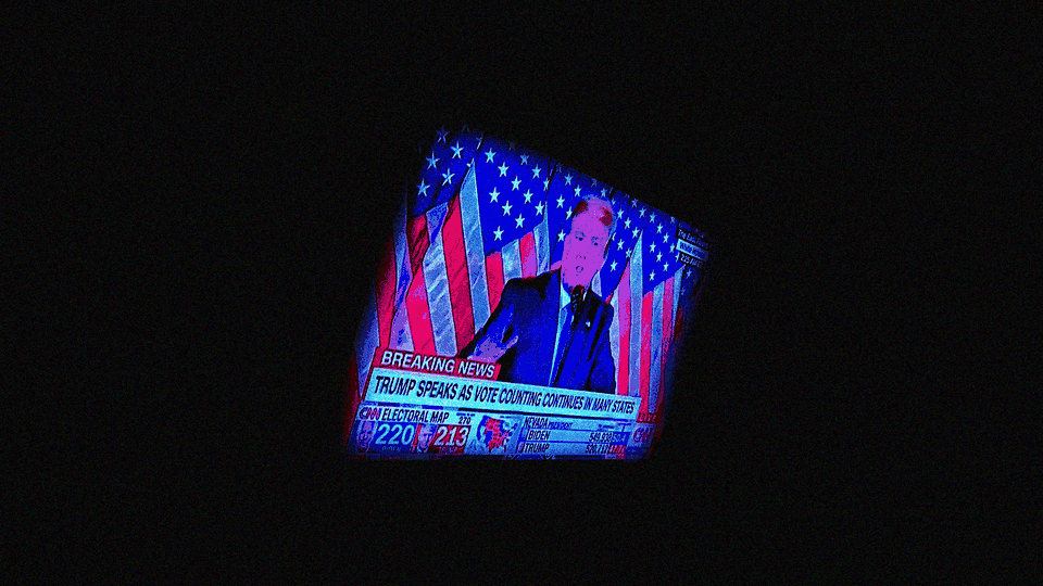 A television showing Donald Trump speaking, surrounded by a thick black border