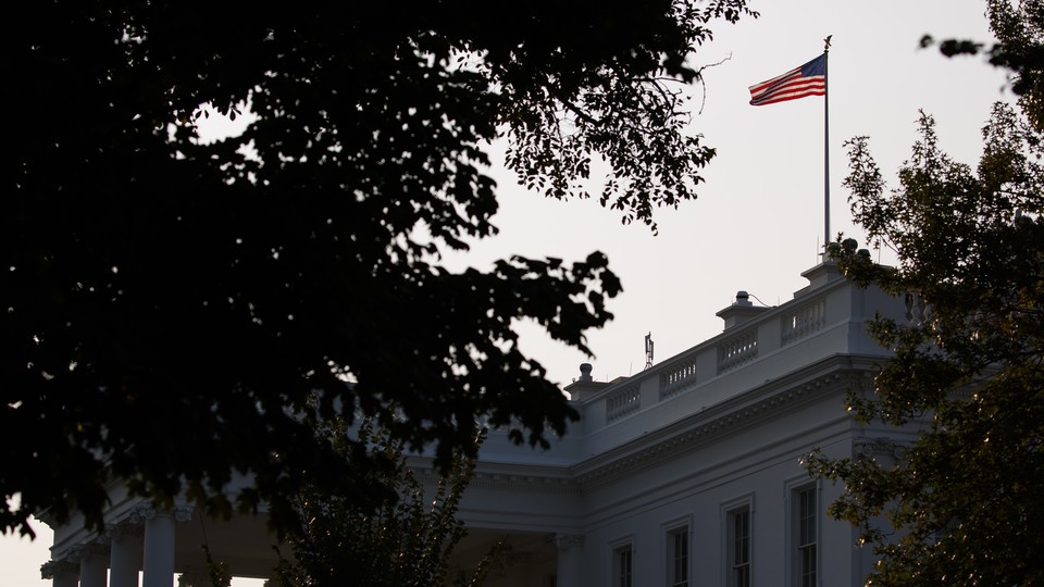 The U.S. flag flies at full-staff over the White House on Monday.