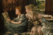 A woman reading over another woman's shoulder