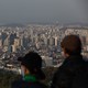People look out at the city skyline from Mount Namsan in Seoul, South Korea