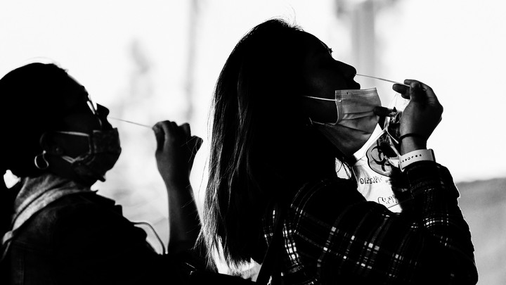 Two women wearing face masks.
