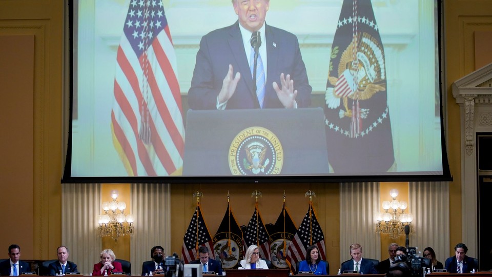 The January 6 committee showing a video of Donald Trump