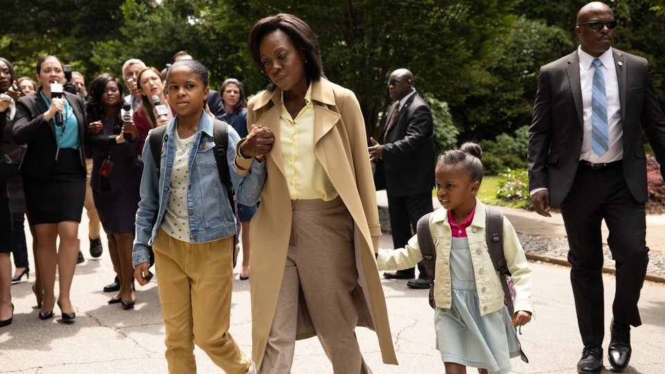 Michelle Obama (played by Viola Davis) walks away from a crowd of reporters in "The First Lady."