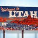 A sign welcomes visitors to the state of Utah.