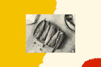 A black and white photo of sardines on toast.
