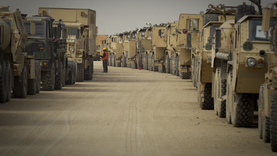 A contractor inspects U.S. military equipment used in Iraq and due to be shipped home or to Afghanistan.