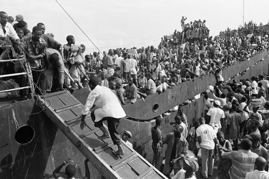 Picture of Liberian civilians crowding onto a ship to escape heavy fighting in the Liberian capital